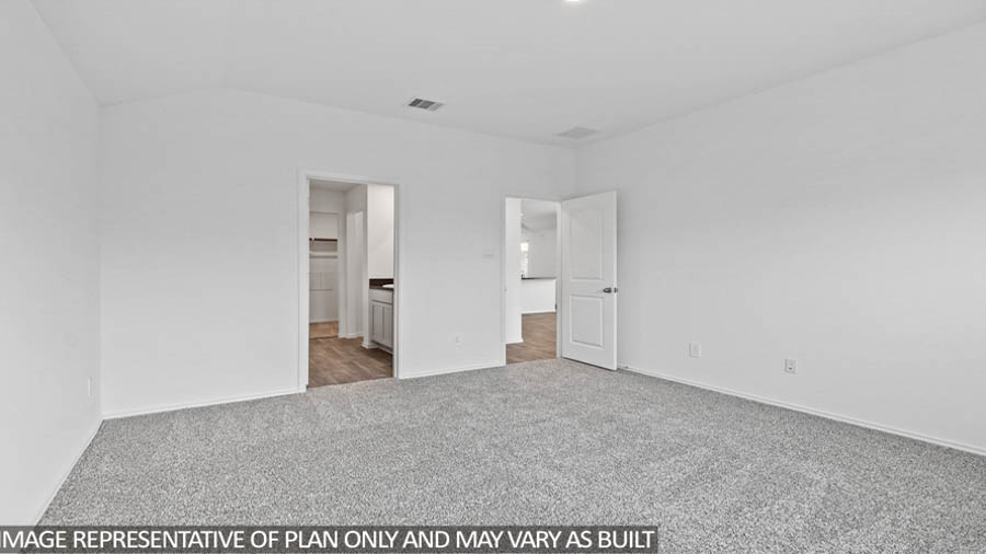 Primary bedroom with carpet flooring