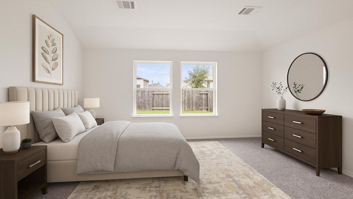 Primary bedroom with carpet flooring