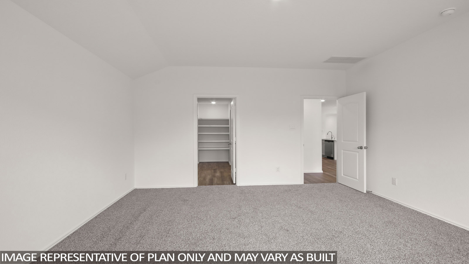 Primary bedroom with carpet flooring