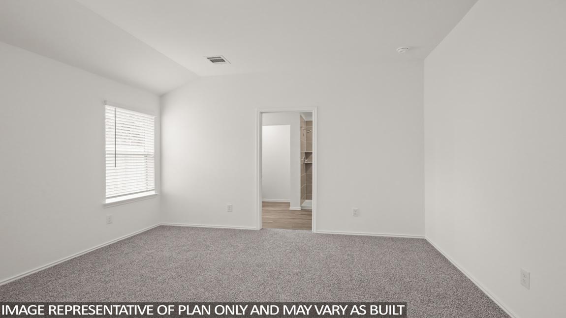 Primary bedroom with carpet flooring