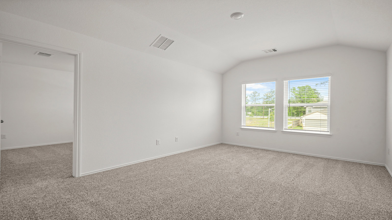 Second story game room with carpet flooring