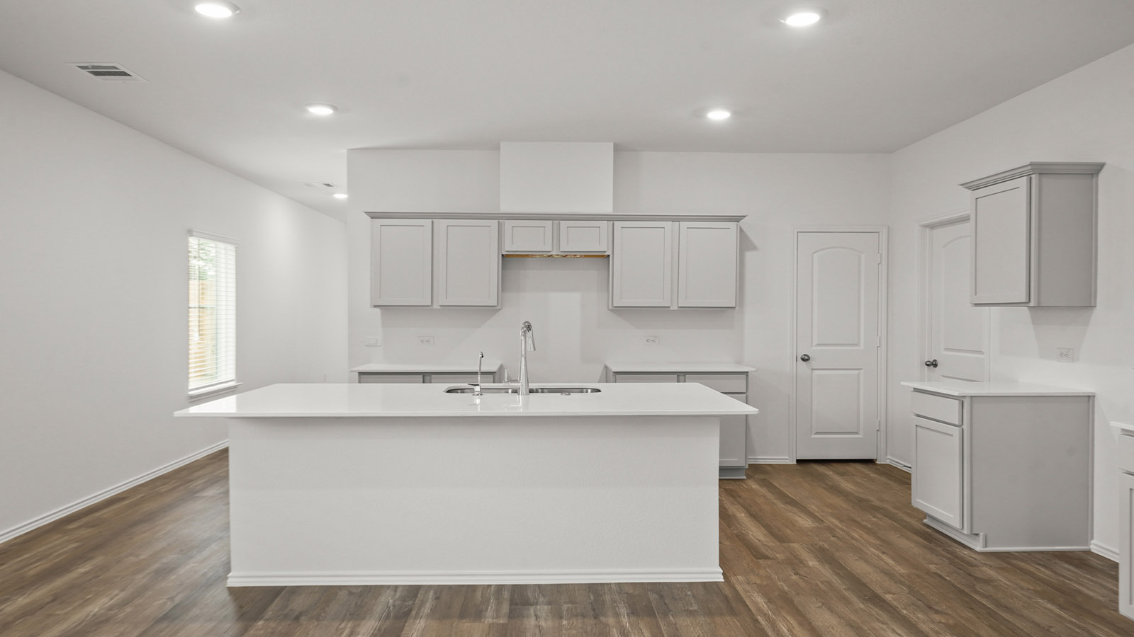 Open concept living, dining, and kitchen area