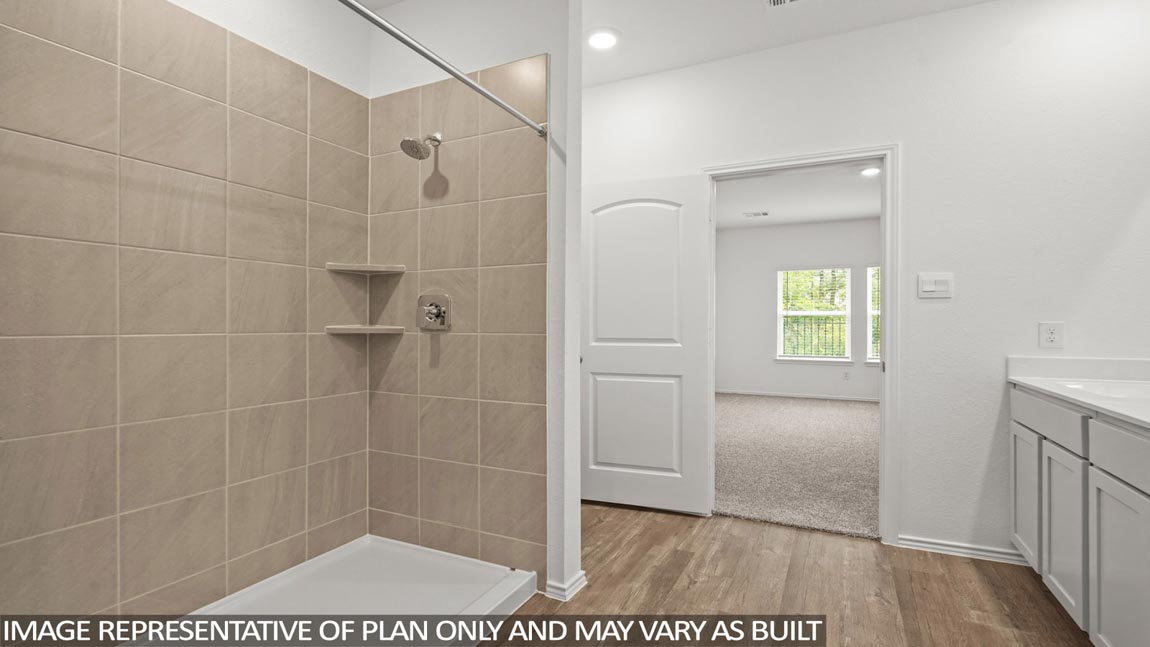 Primary bathroom with shower and linen storage