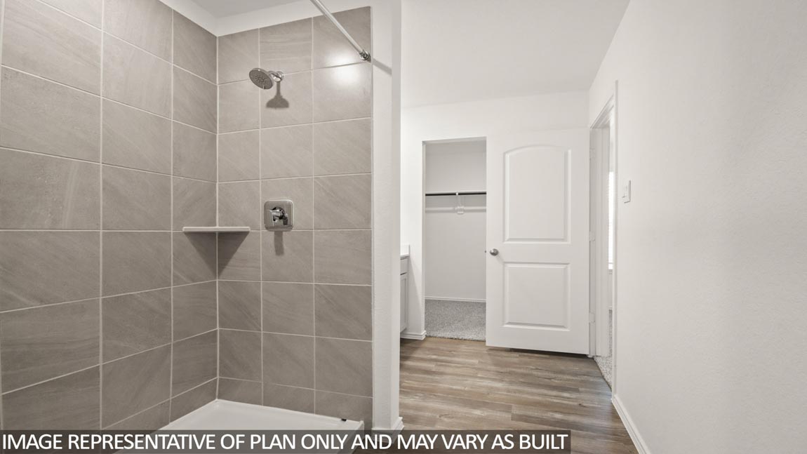 Primary bathroom with shower and linen storage