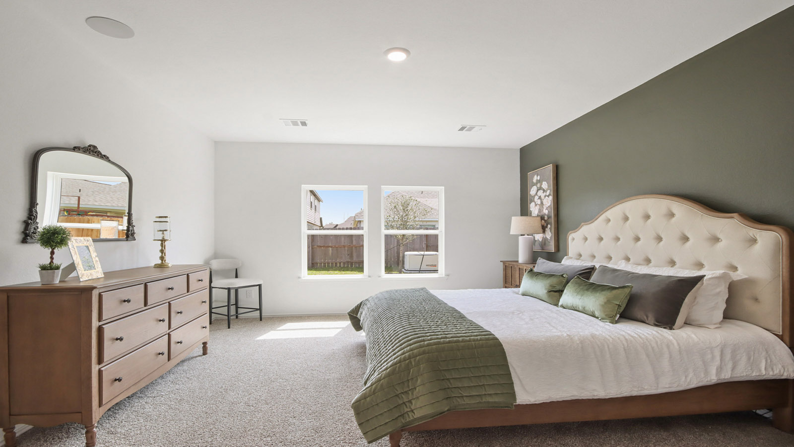 Primary bedroom with carpet flooring