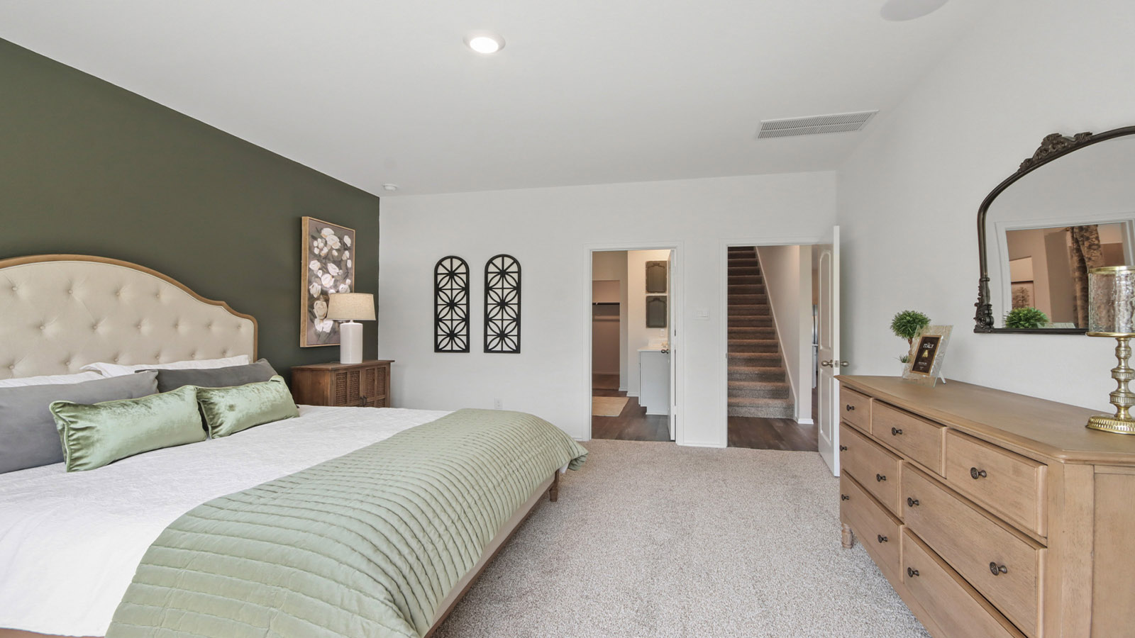 Primary bedroom with carpet flooring