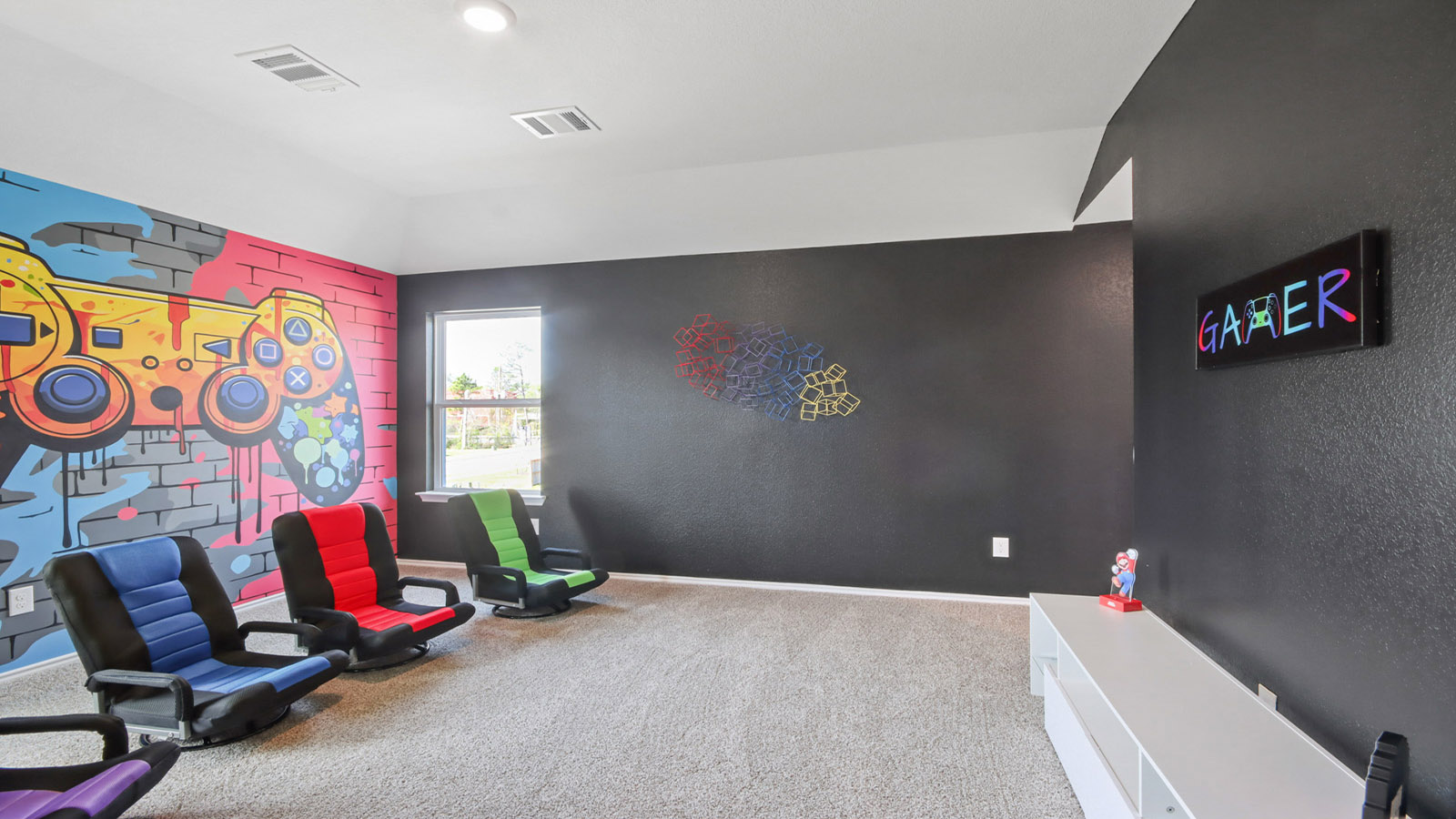 Second story game room with carpet flooring