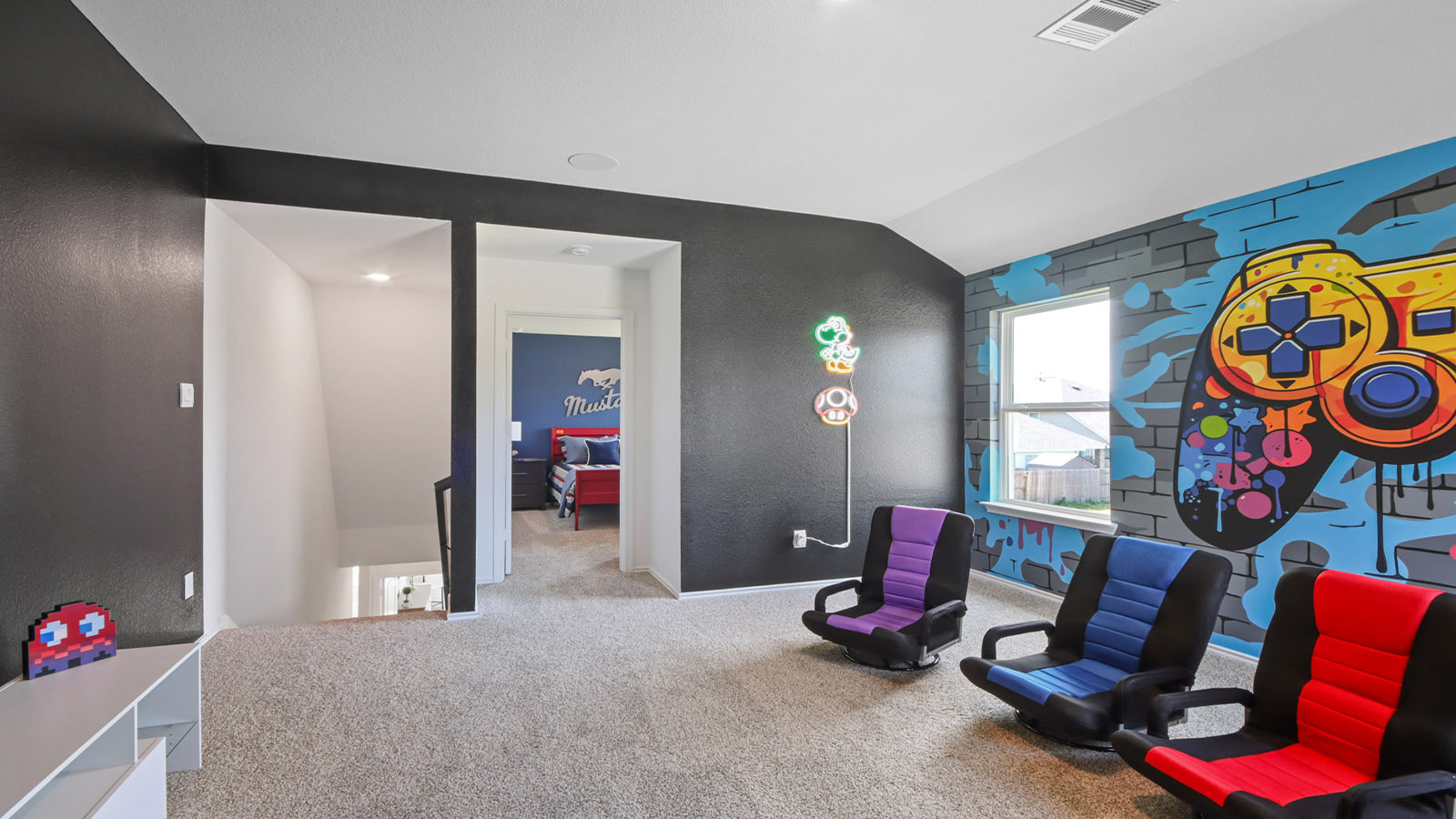 Second story game room with carpet flooring