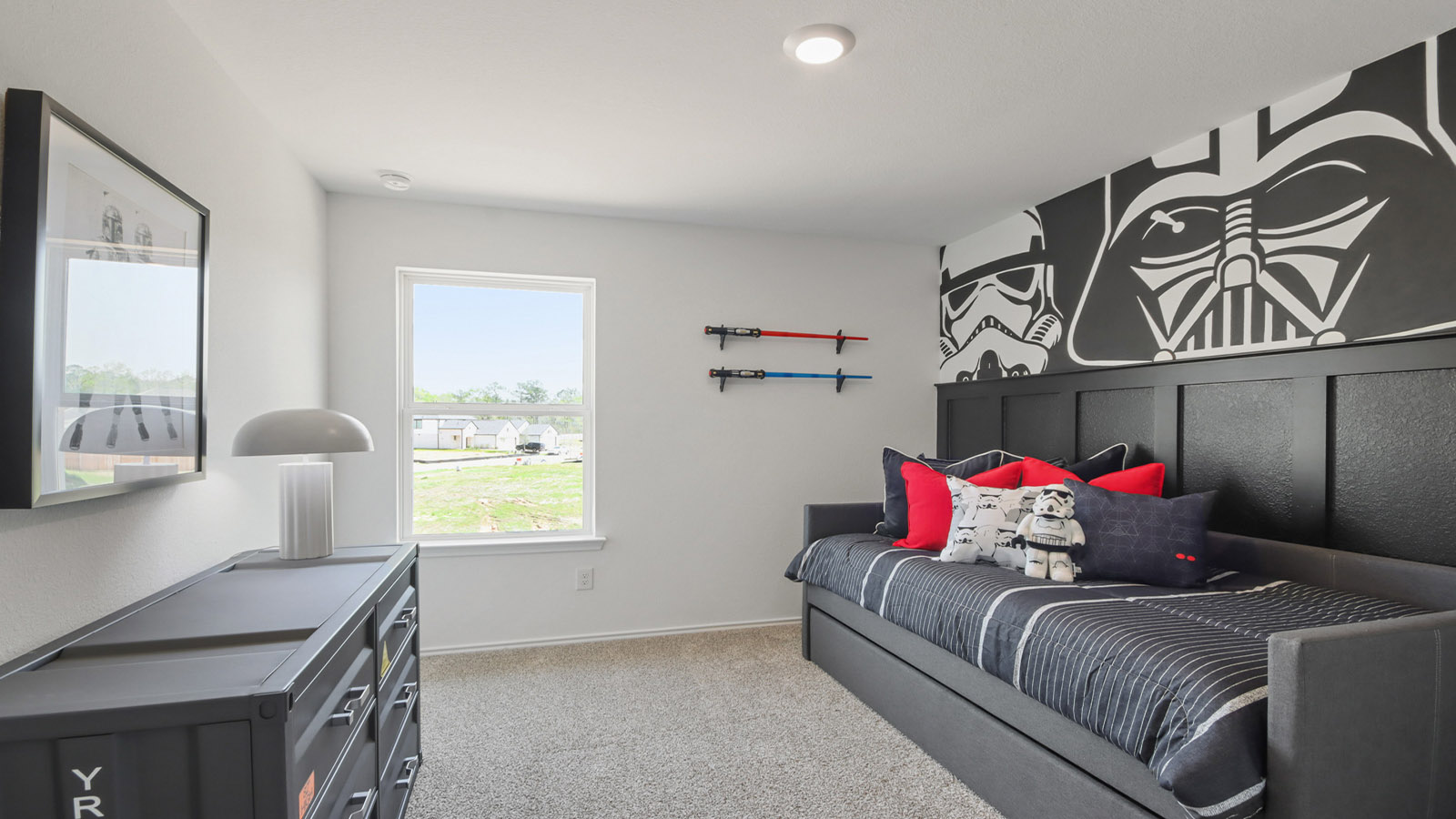 Secondary bedroom with carpet flooring