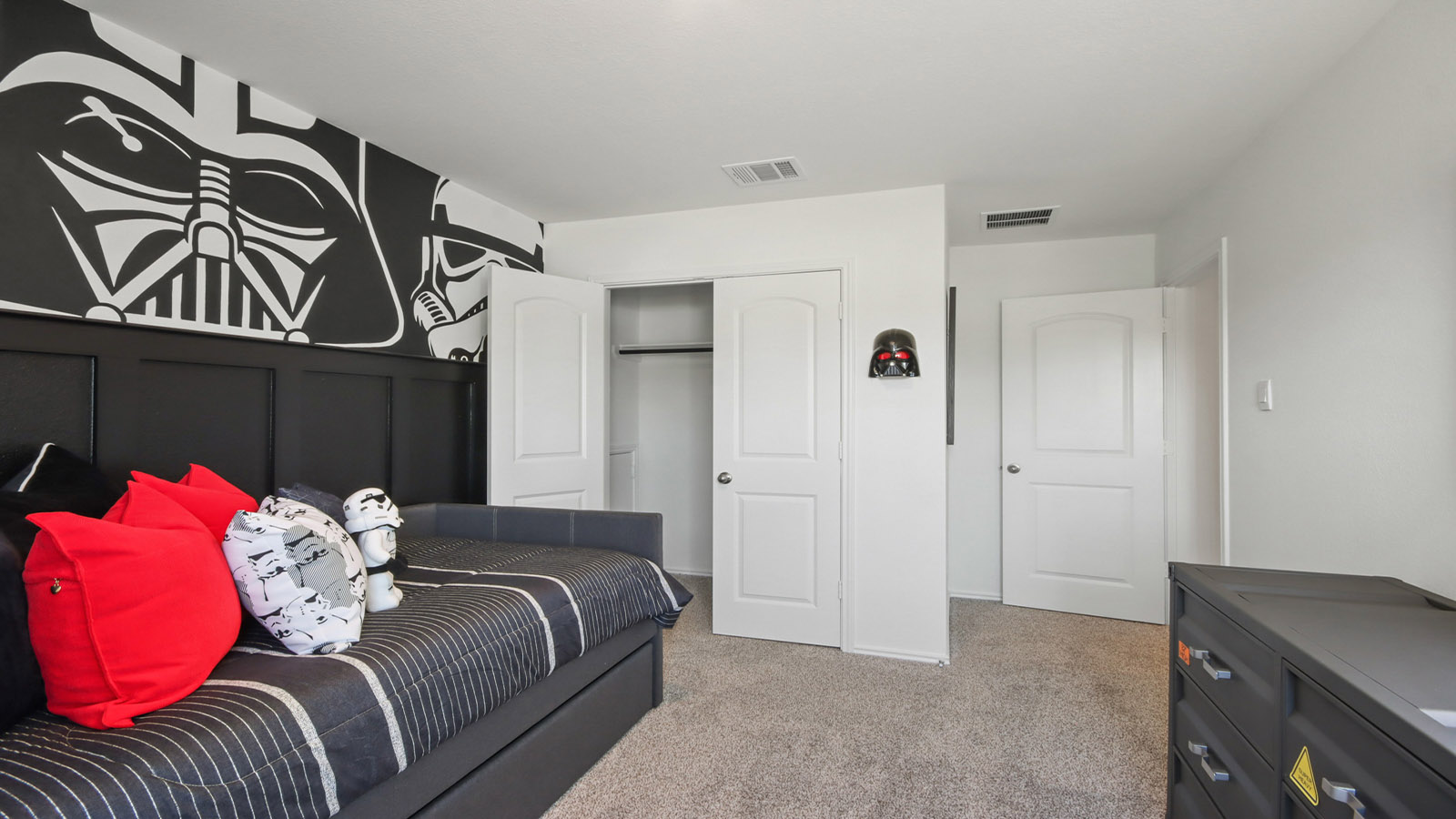 Secondary bedroom with carpet flooring