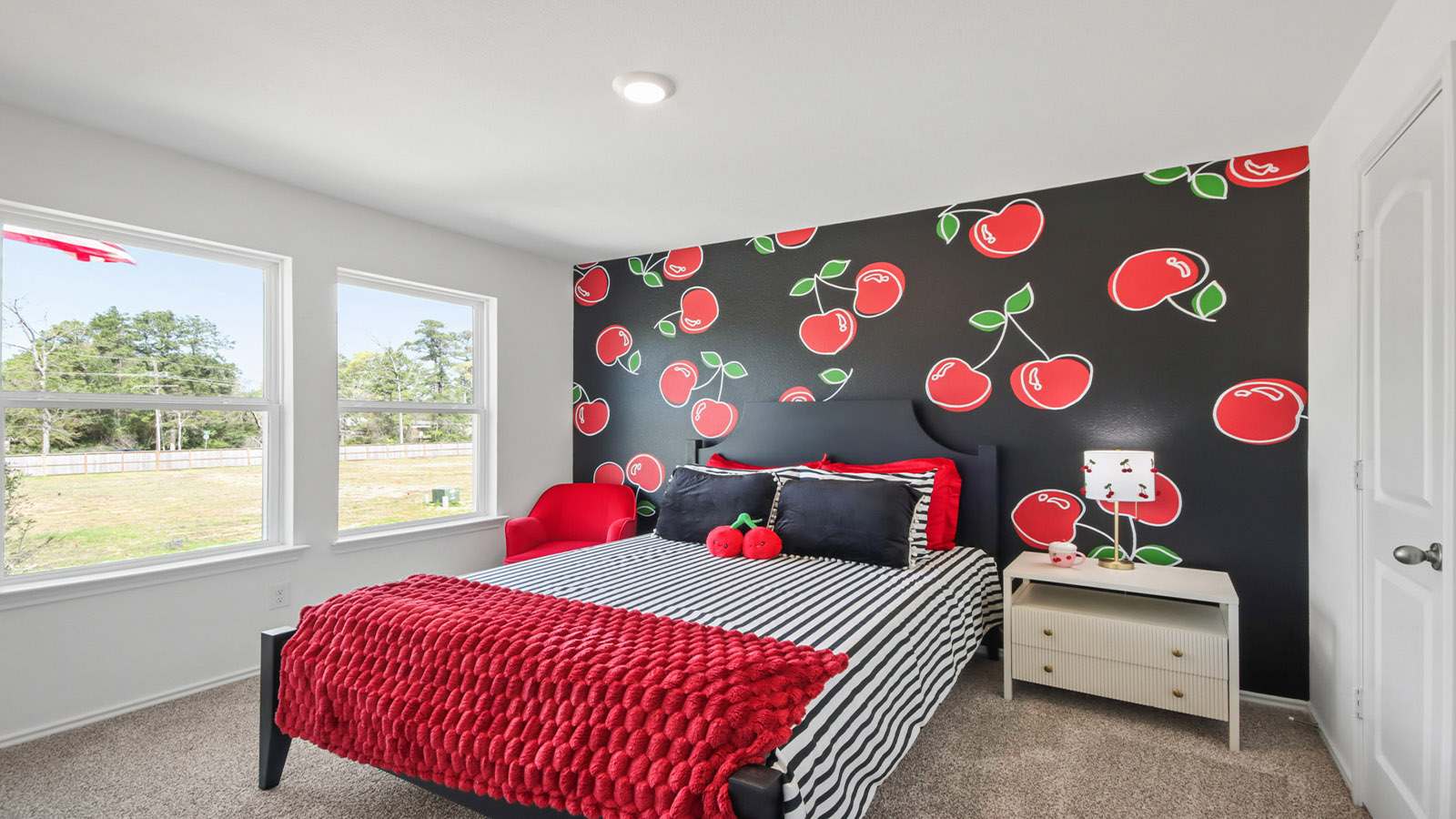 Secondary bedroom with carpet flooring