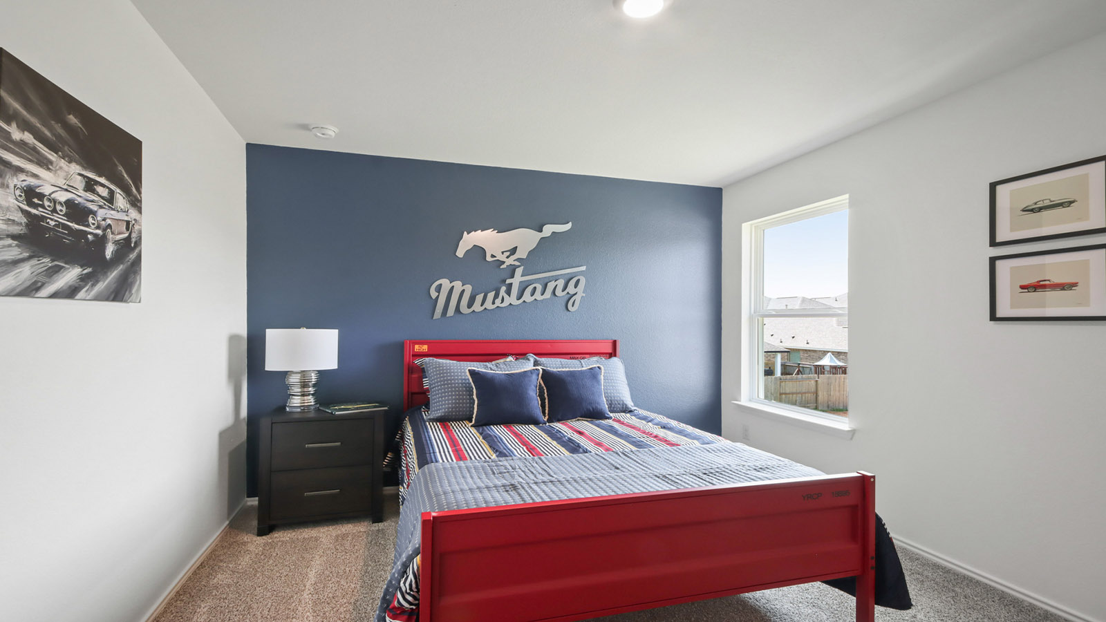 Secondary bedroom with carpet flooring