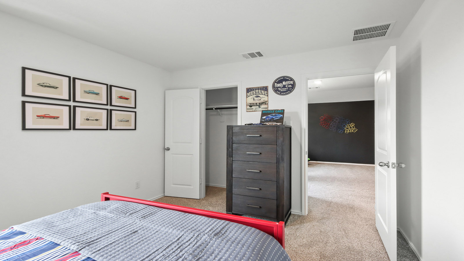 Secondary bedroom with carpet flooring
