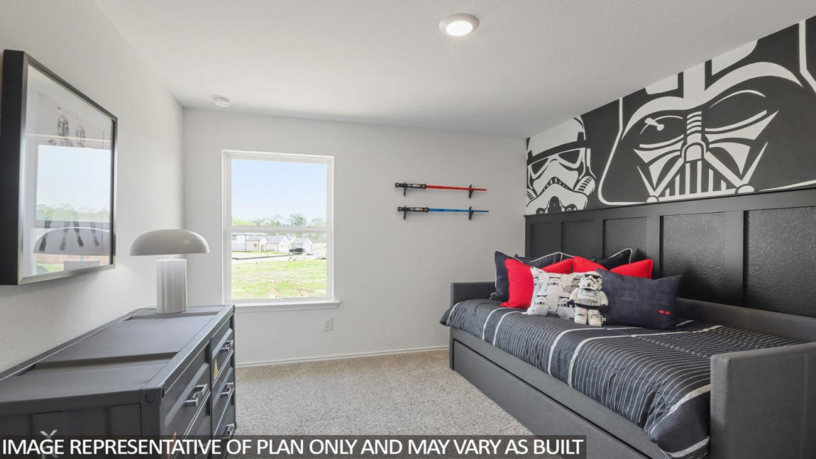 Secondary bedroom with carpet flooring