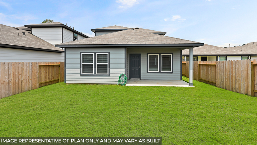 Spacious backyard with back patio and overhead storage space.
