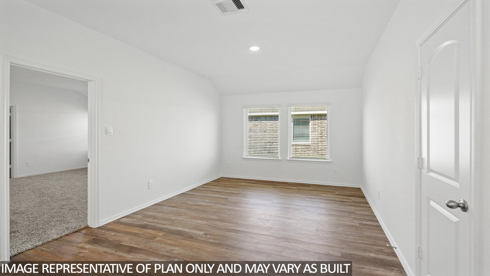 open concept dining and living area with vinyl flooring
