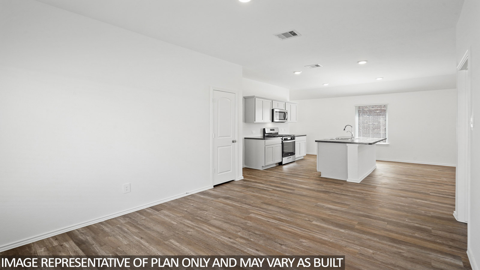 open concept dining and living area with vinyl flooring