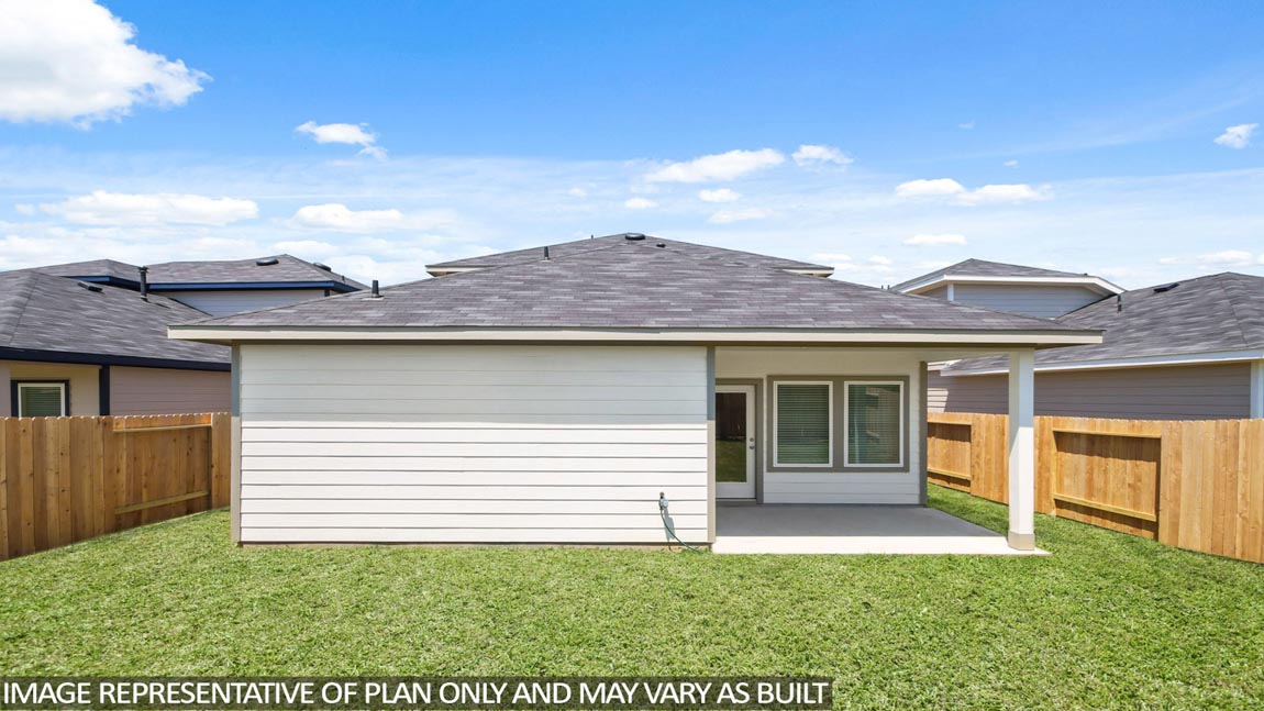 Spacious backyard with back patio and overehead light.
