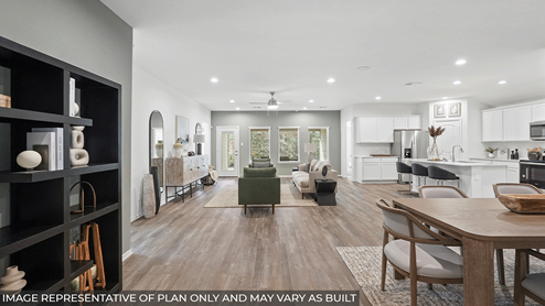Spacious living area with vinyl flooring