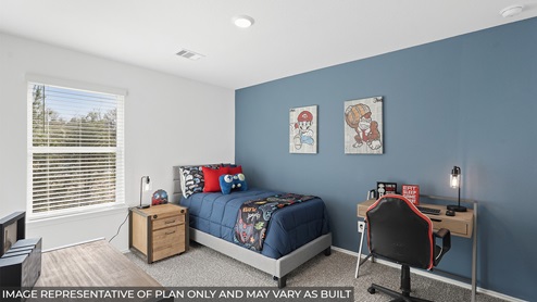 Secondary bedroom with carpet flooring