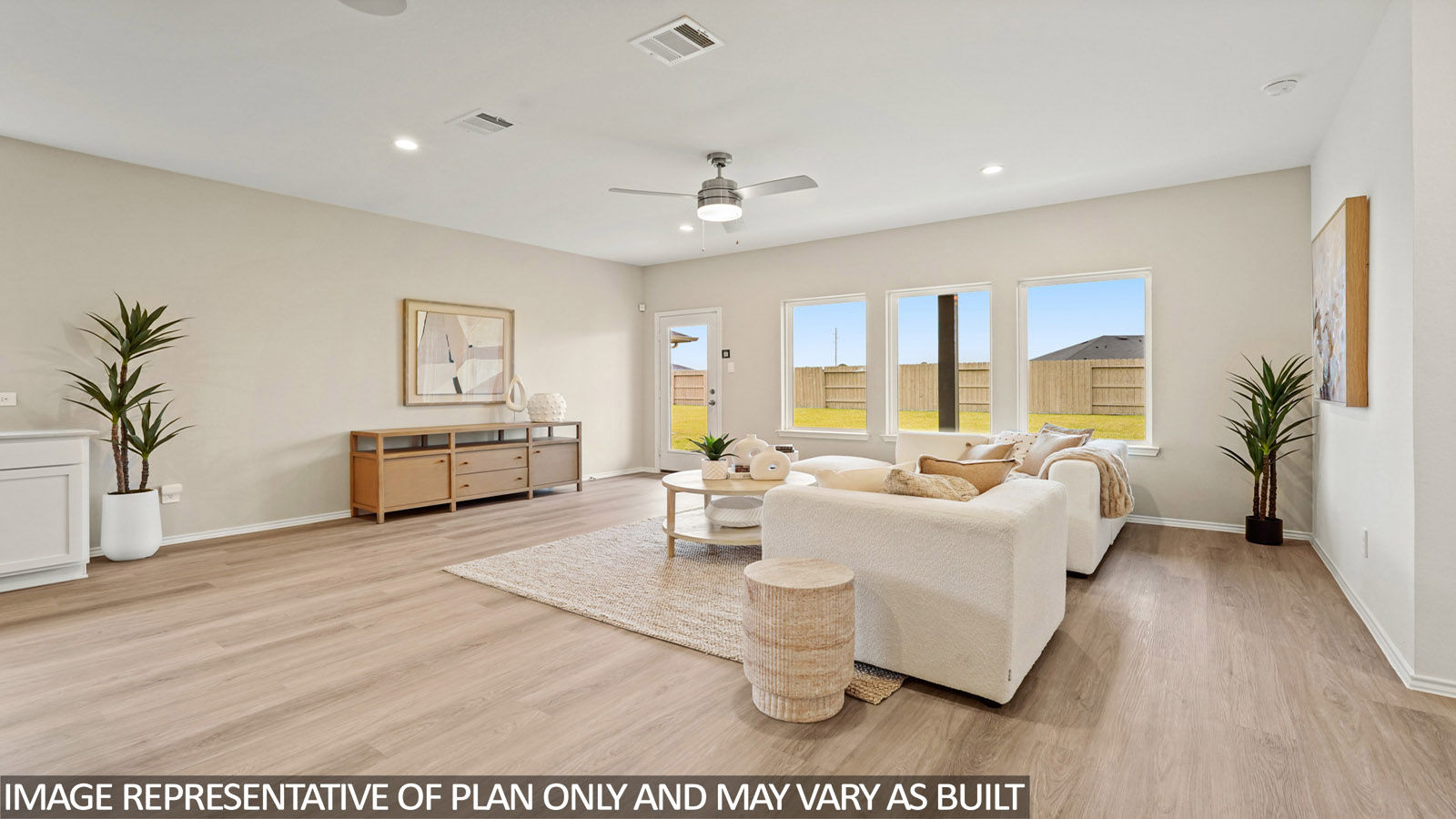 Spacious living area with vinyl flooring