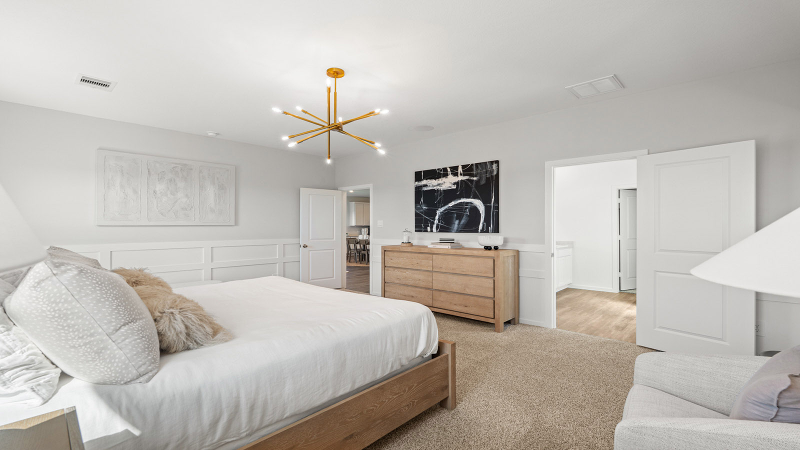 Primary bedroom with carpet flooring