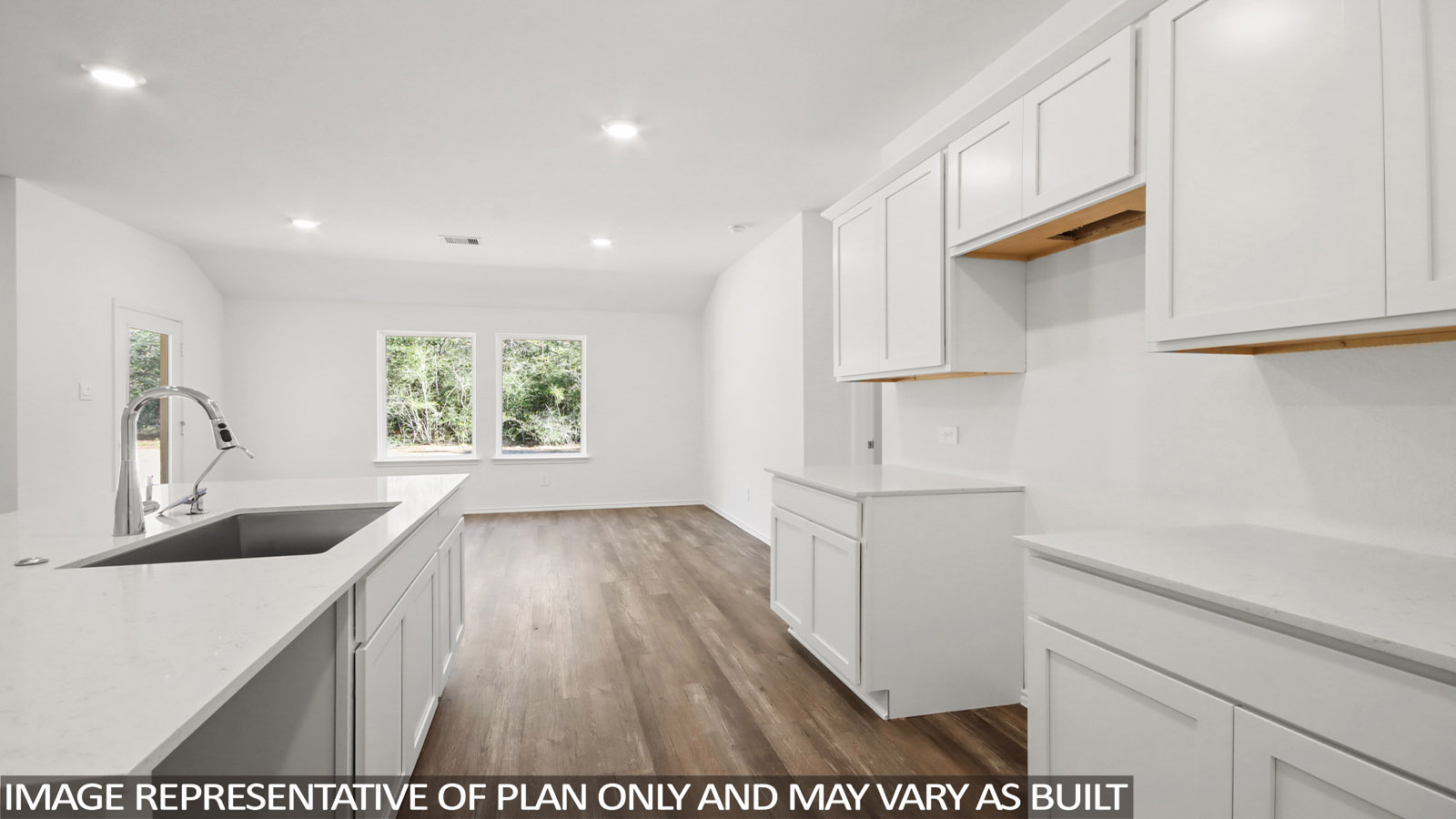 Kitchen with an island and vinyl floor