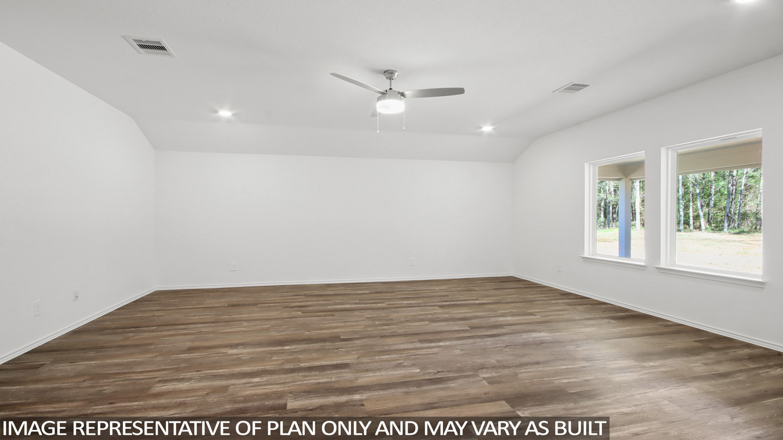 Spacious living area with vinyl flooring