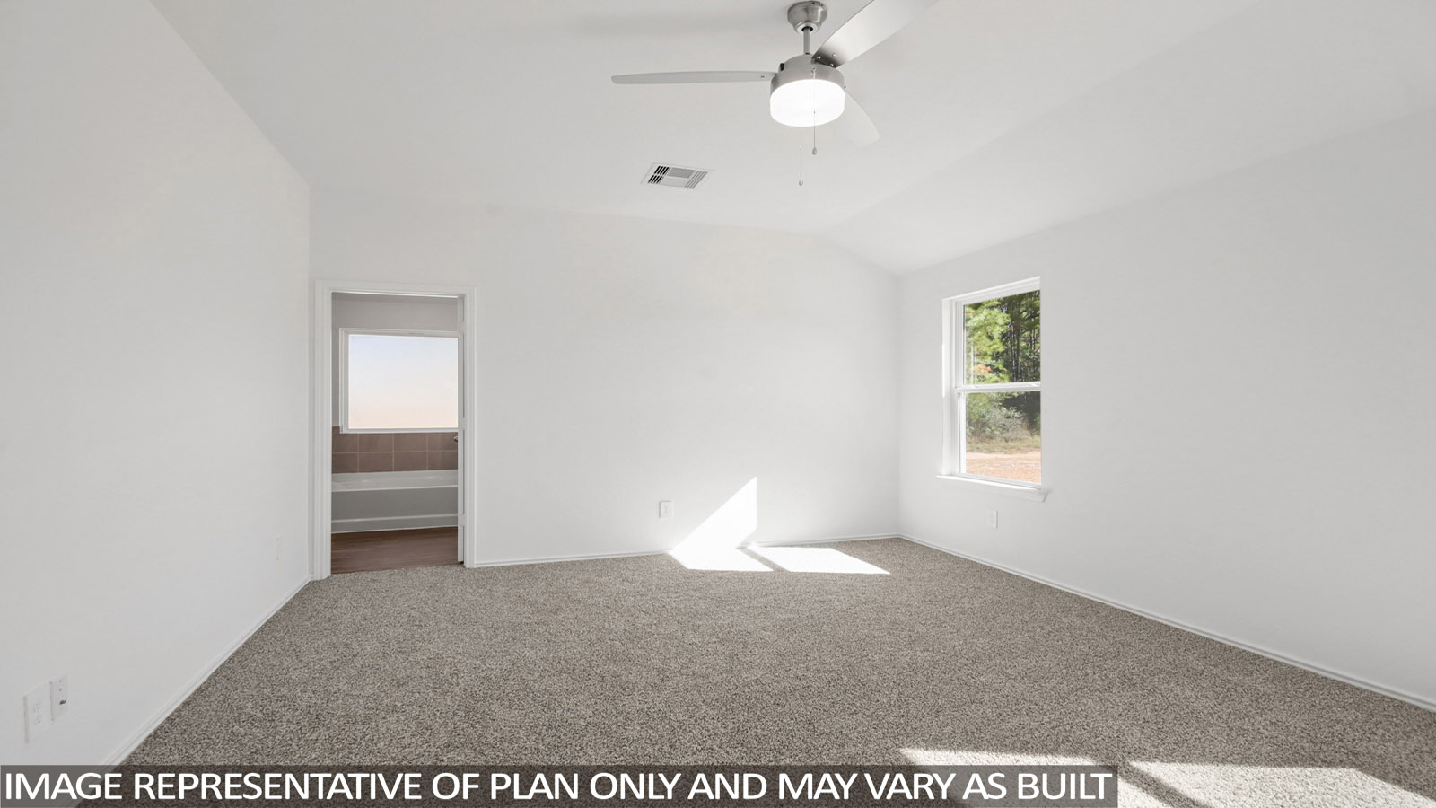 Primary bedroom with carpet flooring