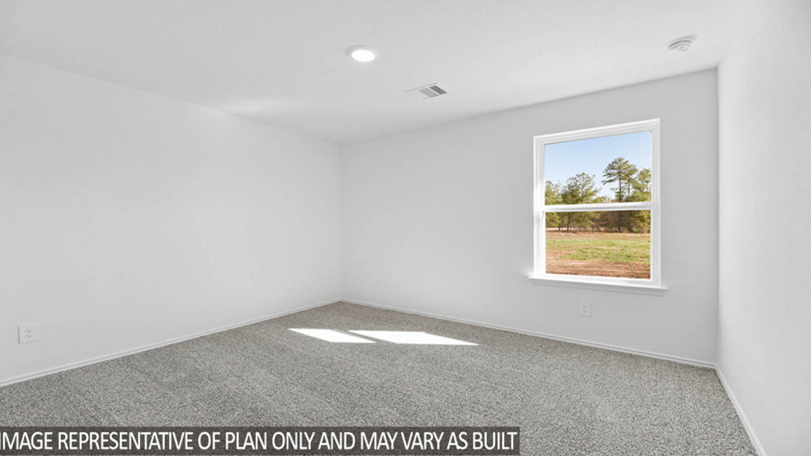 Secondary bedroom with carpet flooring