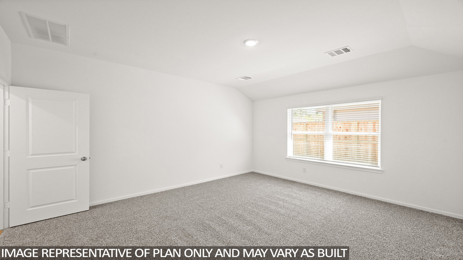 Primary bedroom with bright windows