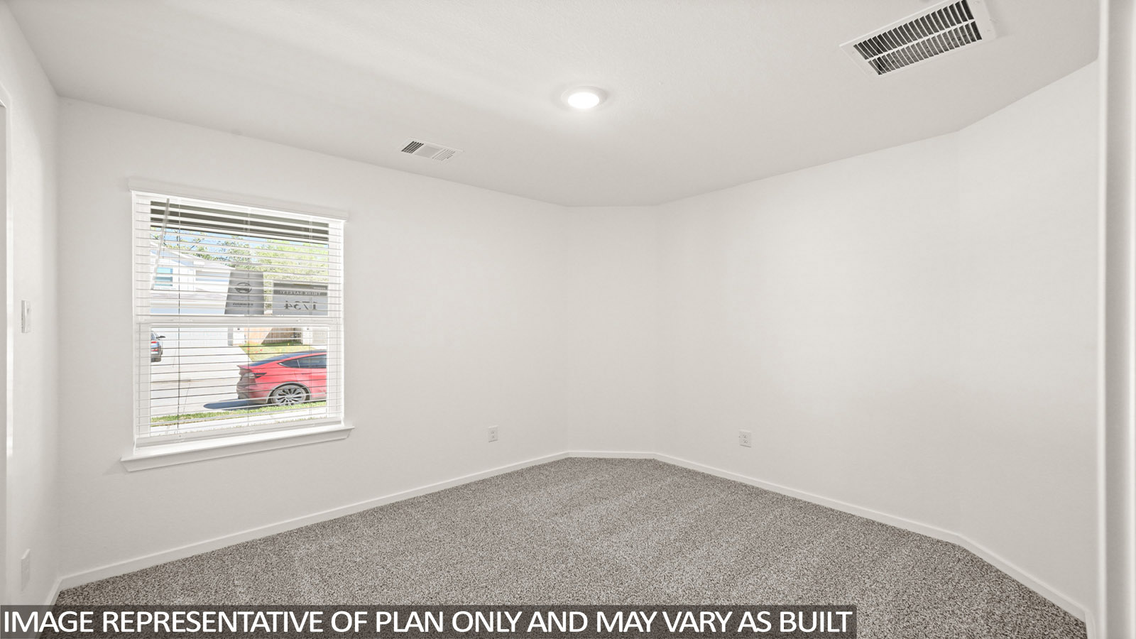 Secondary bedroom with carpet flooring