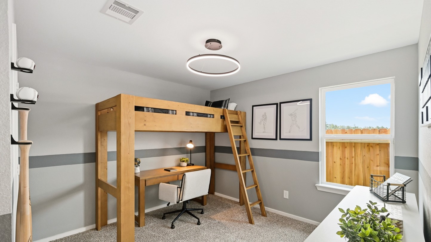 Secondary bedroom with carpet flooring