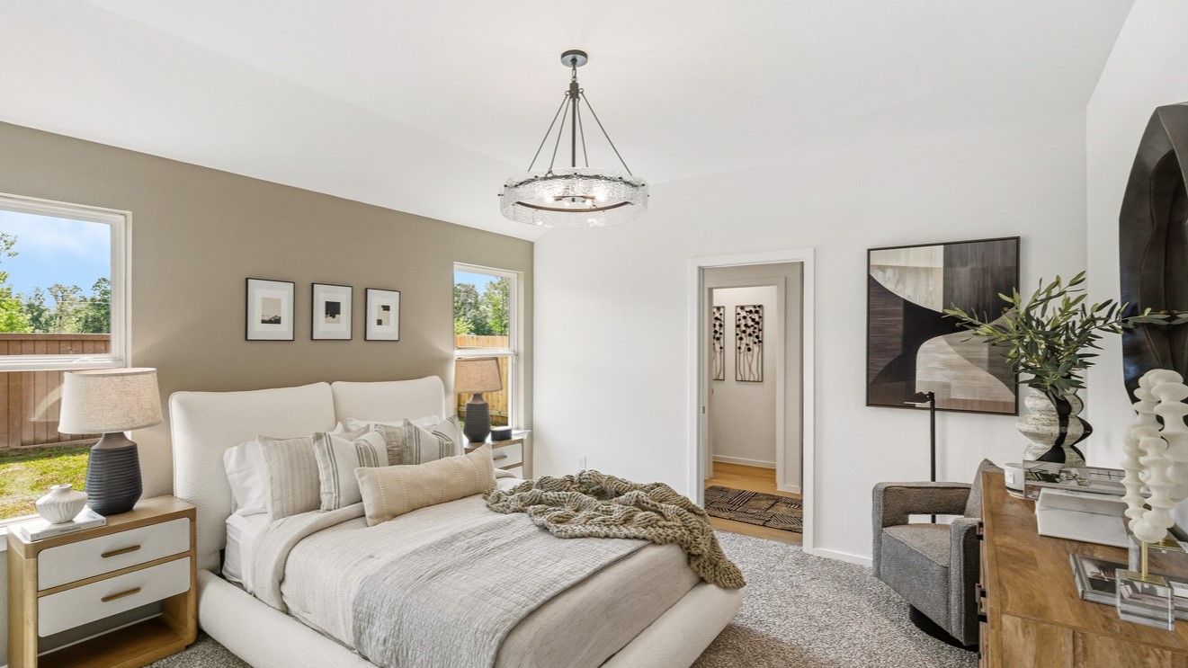 Primary bedroom with bright windows