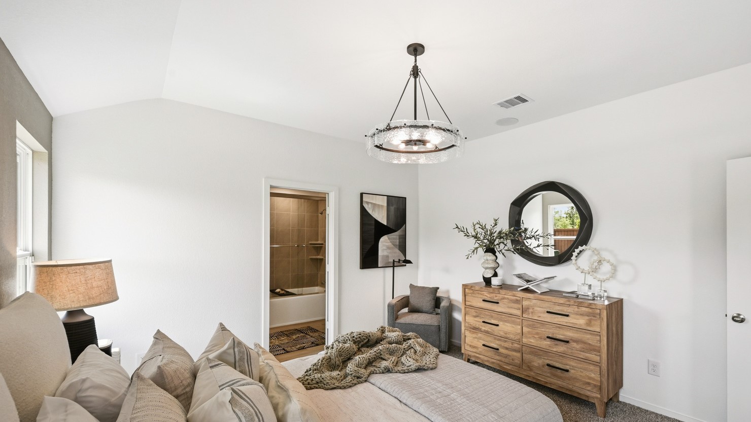 Primary bedroom with bright windows