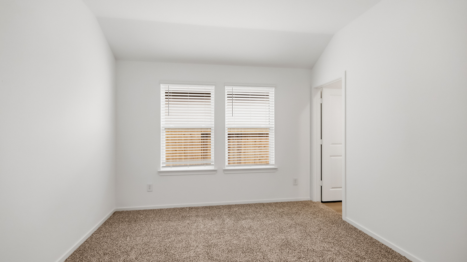 primary bedroom with bright windows