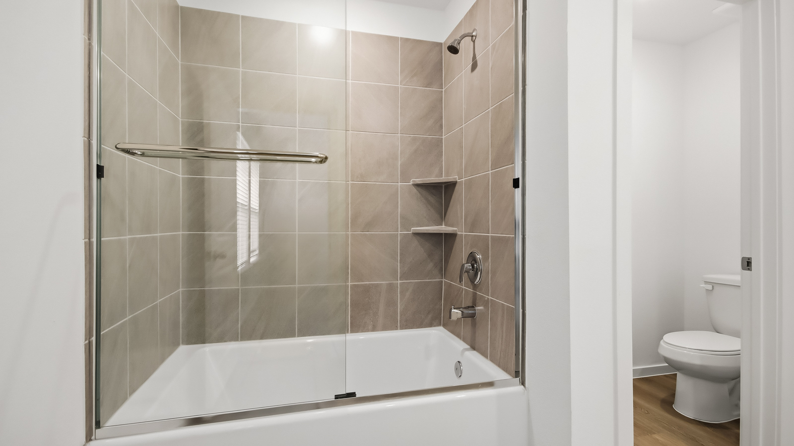 primary bathroom with shower and toilet room
