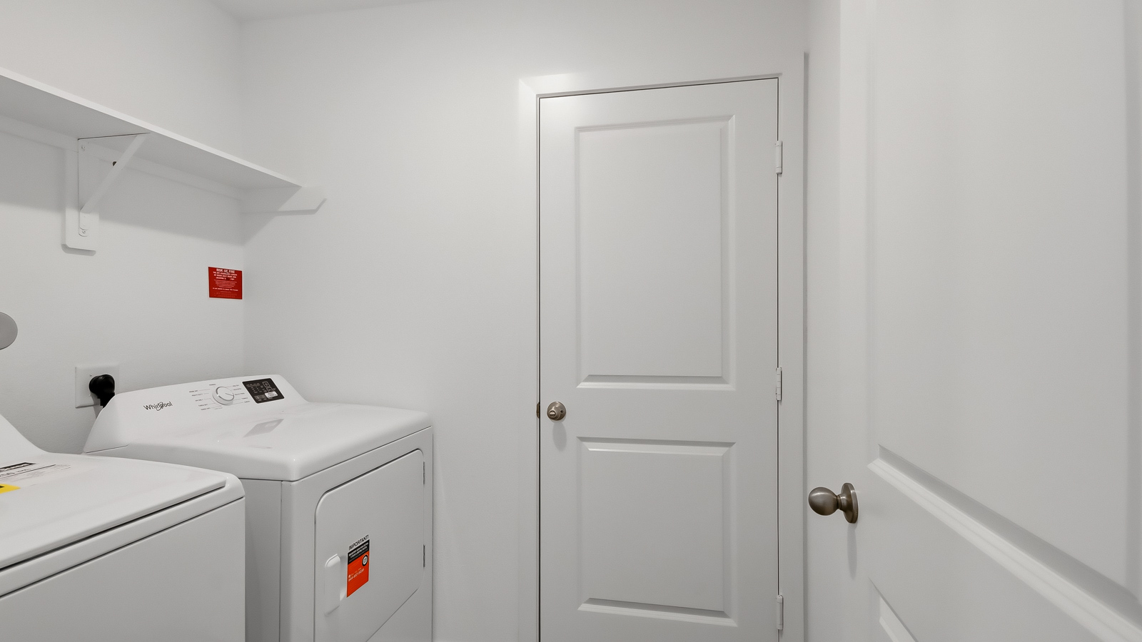 laundry room with some storage