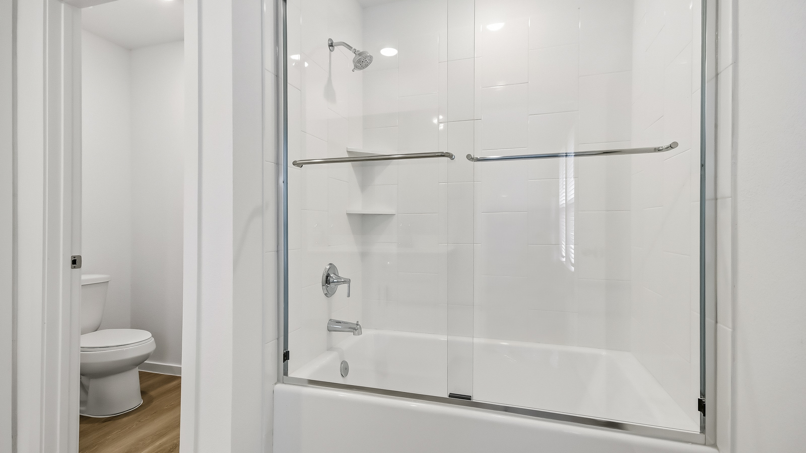 Primary bathroom with shower and linen storage