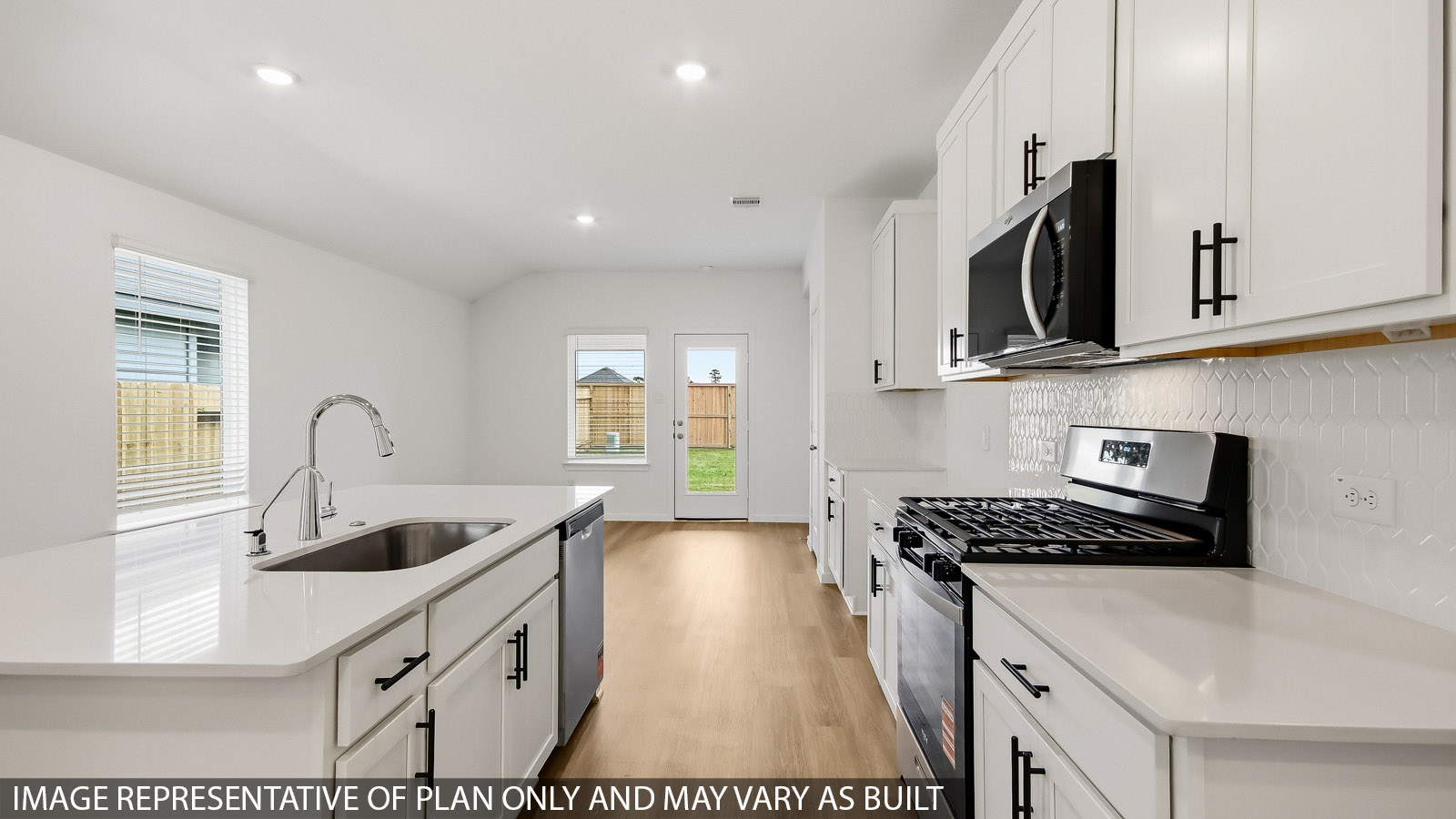 Kitchen with an island and vinyl floor