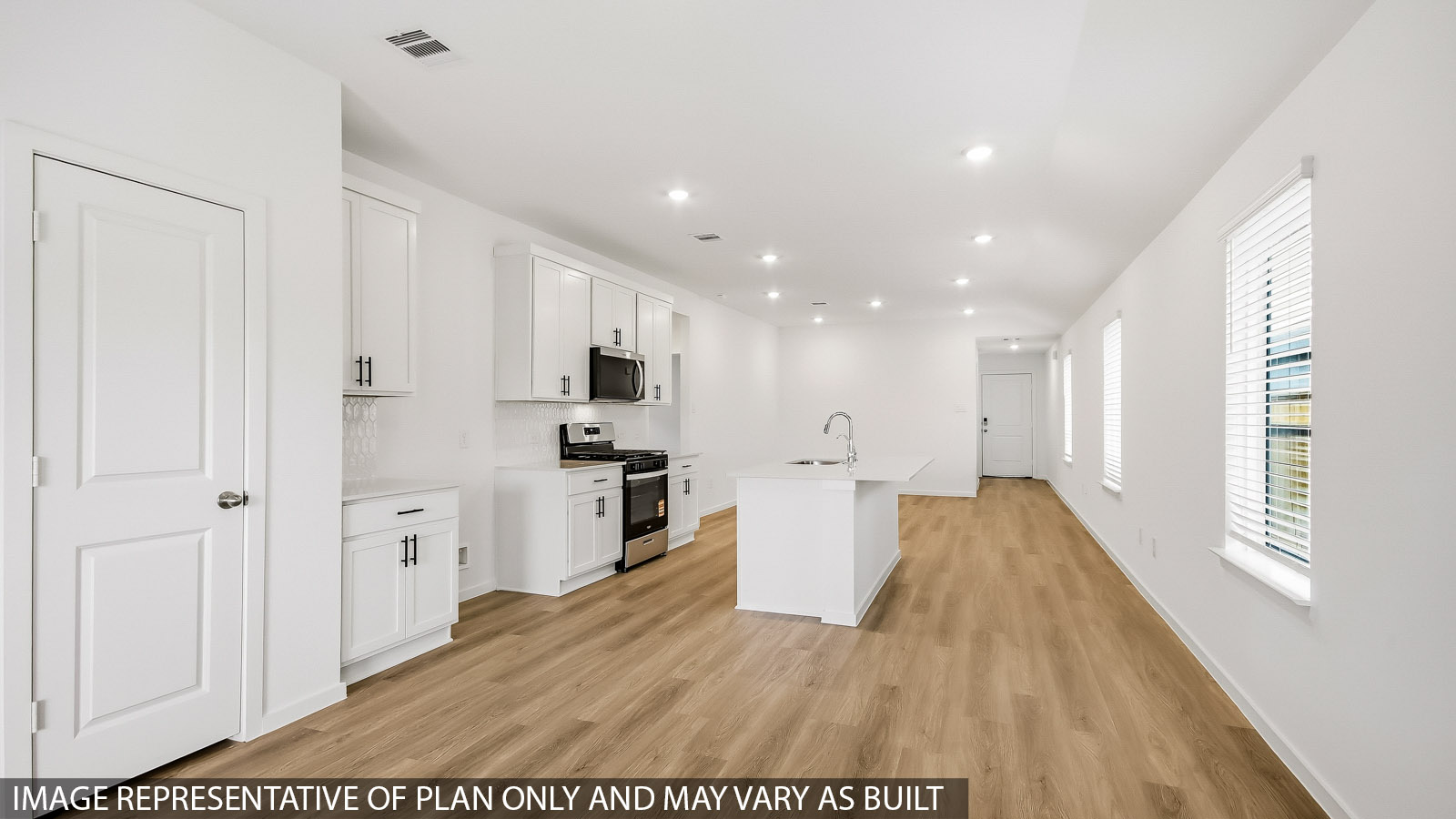 Spacious living area with vinyl flooring