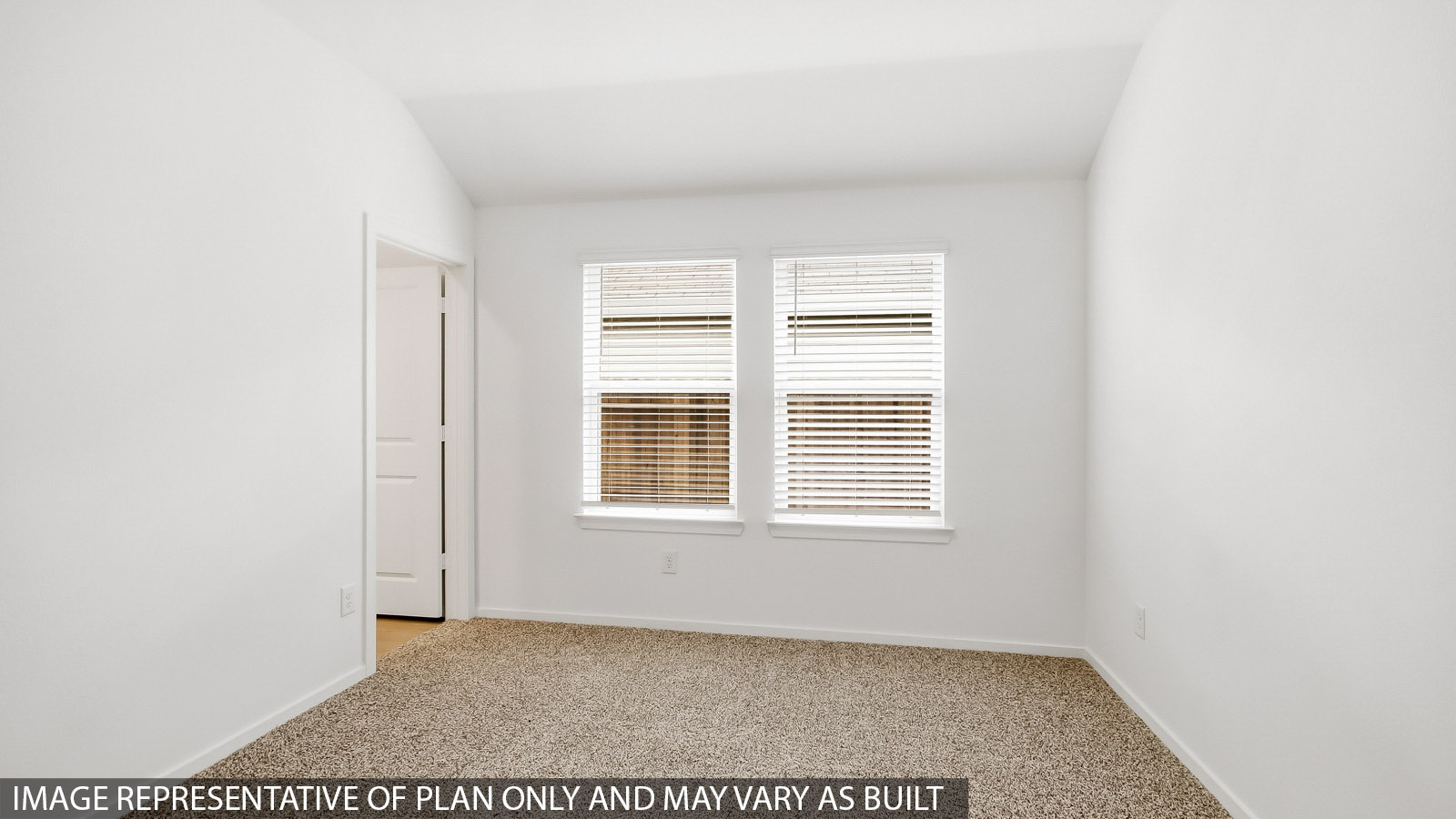 Primary bedroom with carpet flooring