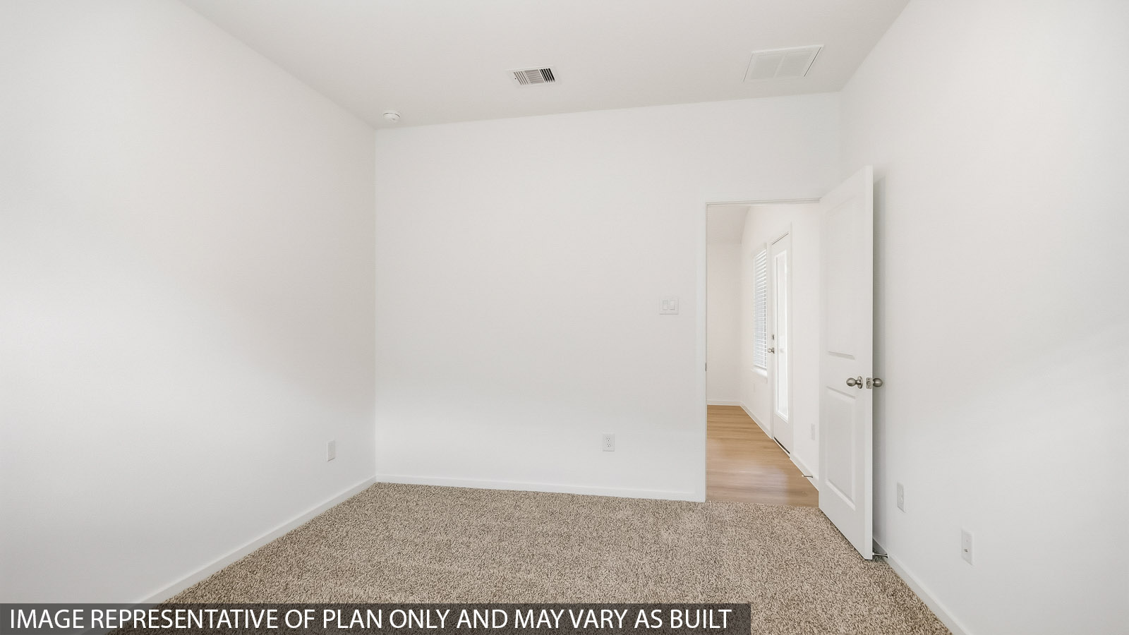 Primary bedroom with bright windows