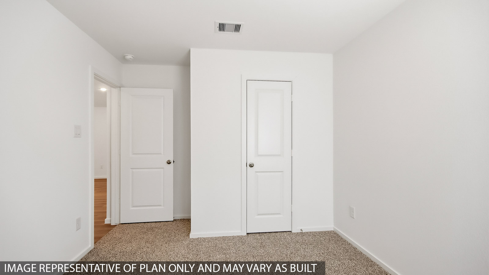 secondary bedroom with tall closet