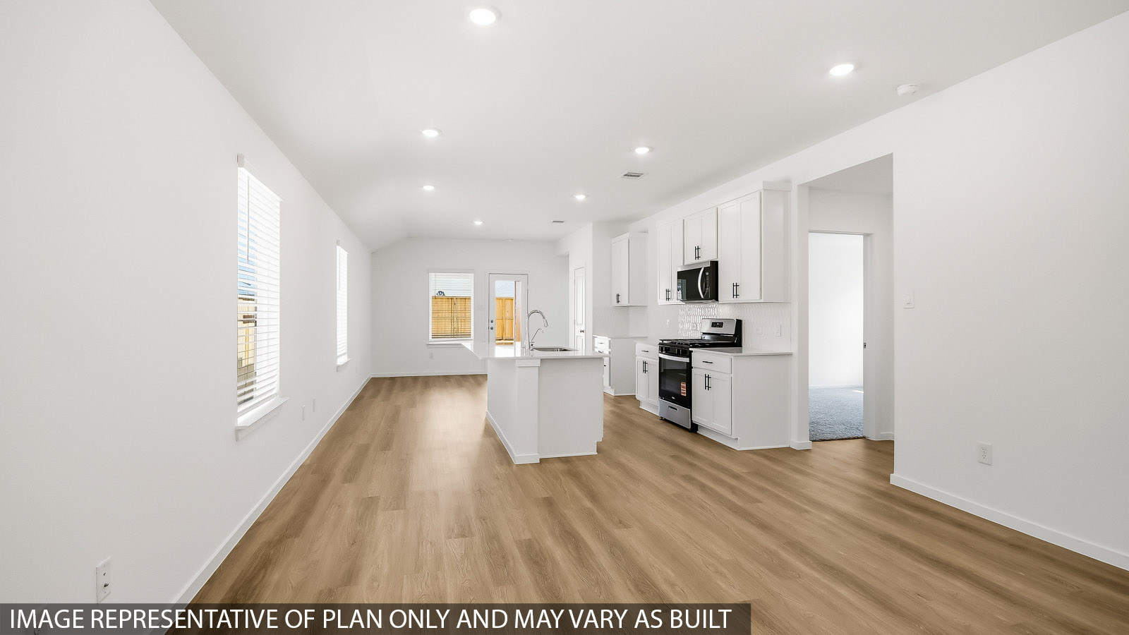 Open concept living, dining, and kitchen area