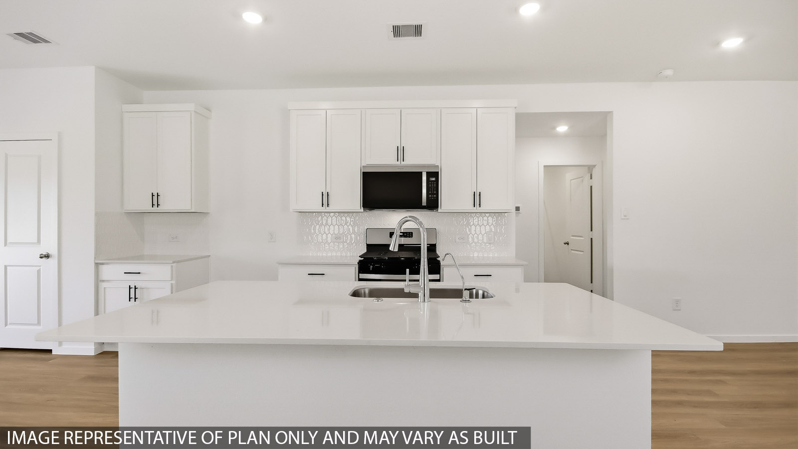 Kitchen with an island and vinyl floor