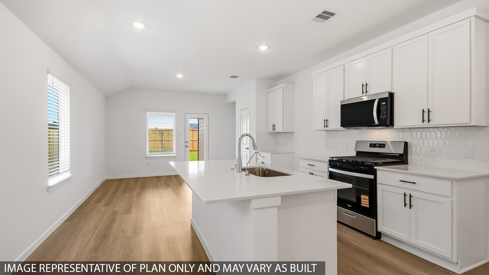 Kitchen with an island and vinyl floor