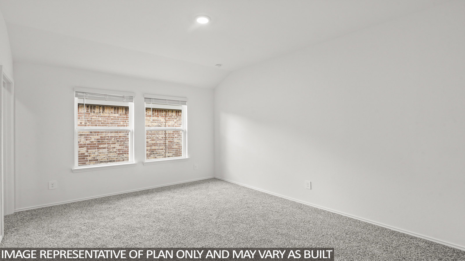 Primary bedroom with carpet flooring