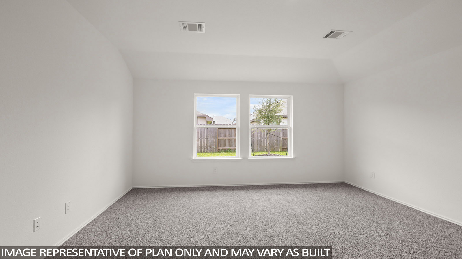 Primary bedroom with carpet flooring