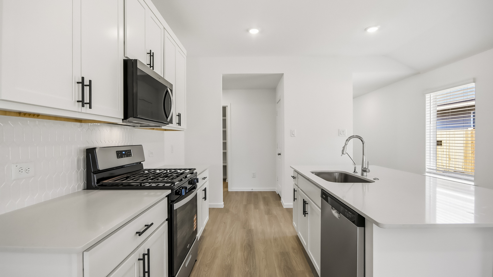Kitchen with an island and vinyl floor